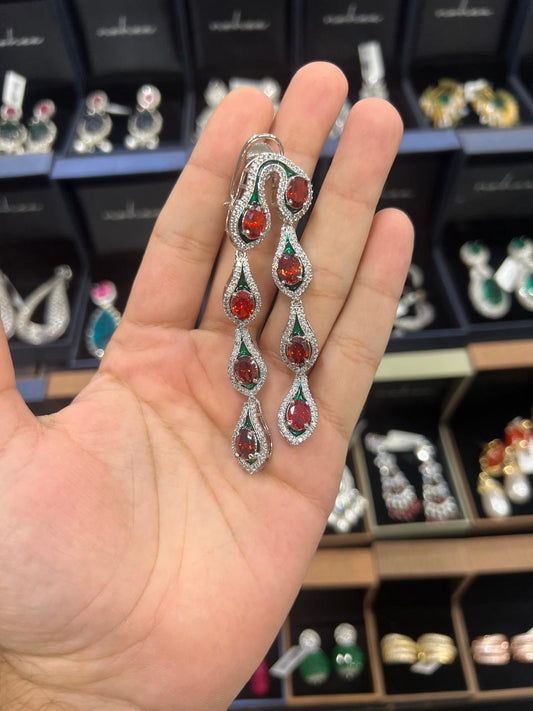 Bright coral doublets with green meena double hanging earrings